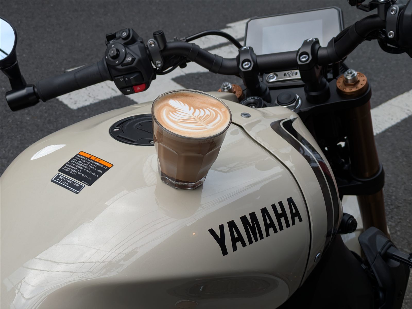 Latte resting on a Yamaha motorcycle tank
